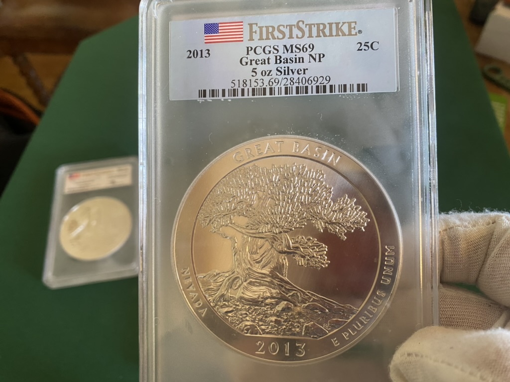 2013 Great Basin 5 oz Silver America the Beautiful — PCGS MS69 First Strike — obverse shown in hand, photographed in hand at Capstone Metals.