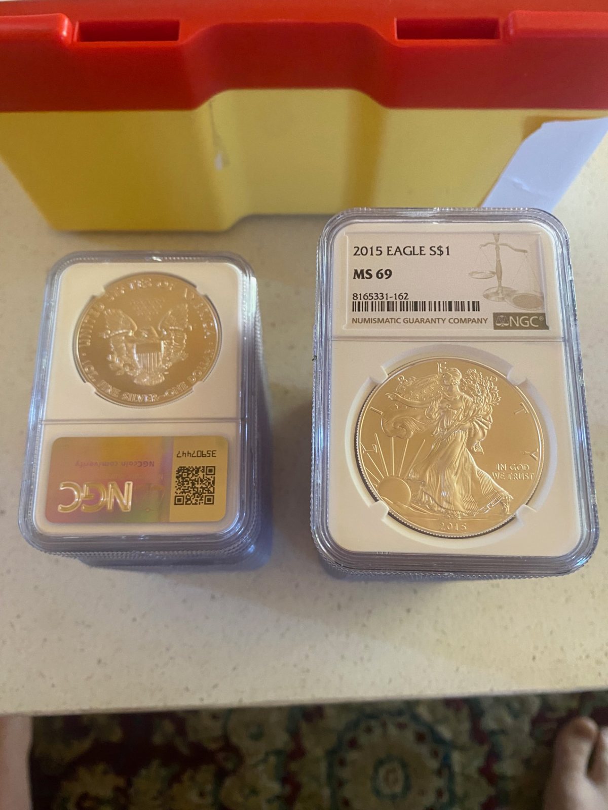 American Silver Eagle 1 oz — NGC MS69 (Random Year) (silver) — obverse shown in hand, photographed in hand at Capstone Metals.