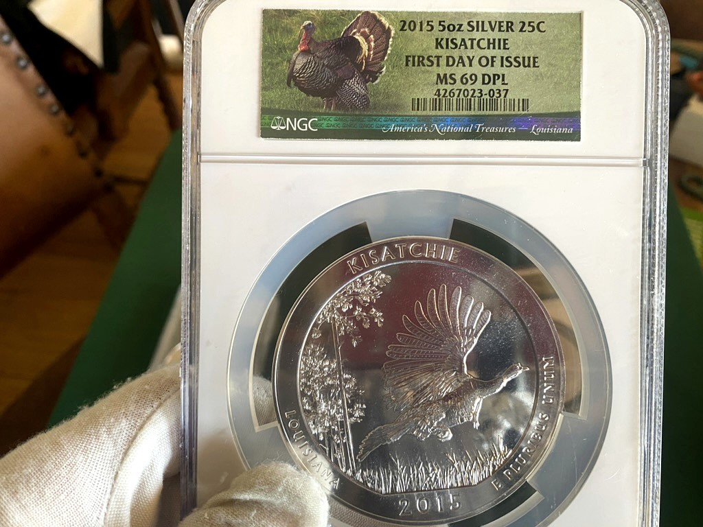 2015 Kisatchie 5 oz Silver ATB — NGC MS69 DPL First Day of Issue — obverse shown in hand, photographed in hand at Capstone Metals.