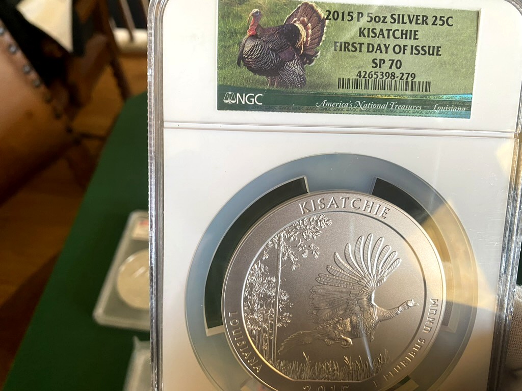 2015-P Kisatchie 5 oz Silver ATB — NGC SP70 First Day of Issue — obverse shown in hand, photographed in hand at Capstone Metals.