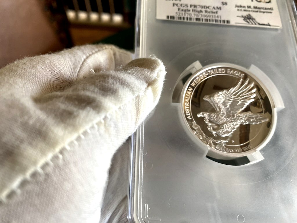 2016-P Australia $8 Wedge-Tailed Eagle 5 oz Silver High Relief — PCGS PR70DCAM, Mercanti Signed — obverse shown in hand, photographed in hand at Capstone Metals.