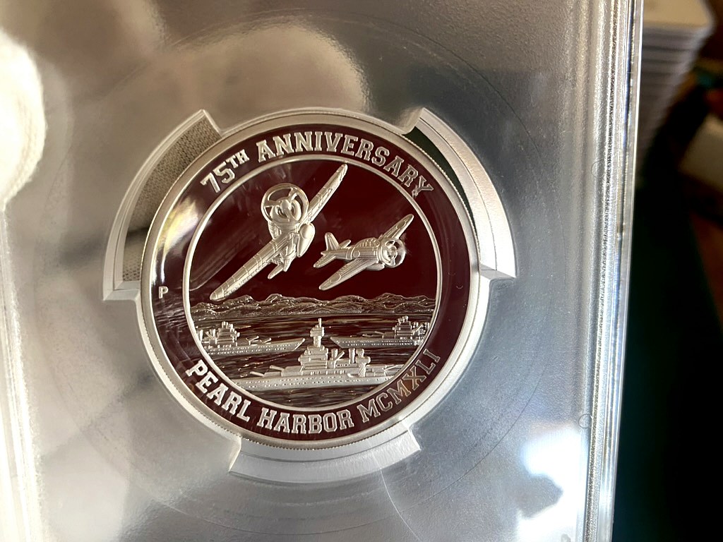 2016 Pearl Harbor 75th Anniversary Silver Proof — PCGS Certified — obverse shown in hand, photographed in hand at Capstone Metals.